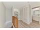 Bright upstairs hallway featuring storage closets, neutral walls, and entryways to the bedrooms at 935 Sunridge Way # B4, Sarasota, FL 34234