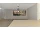 View of Dining Room from kitchen with window at 935 Sunridge Way # B4, Sarasota, FL 34234