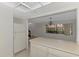 View of kitchen into dining room with window at 935 Sunridge Way # B4, Sarasota, FL 34234