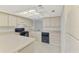 Functional kitchen with countertops, cabinets, stove, oven, and essential appliances at 935 Sunridge Way # B4, Sarasota, FL 34234