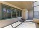 A partially covered patio with textured walls and a view out the window at 935 Sunridge Way # B4, Sarasota, FL 34234