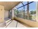 Covered patio with lots of natural light, screening, and view of parking area at 935 Sunridge Way # B4, Sarasota, FL 34234