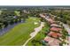 Aerial view showcasing the community golf course, ponds, and landscaping at 9719 Discovery Ter, Bradenton, FL 34212