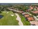 Overhead perspective of golf course community, showcasing ponds and verdant landscaping at 9719 Discovery Ter, Bradenton, FL 34212