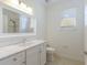 Bathroom with vanity, sink, toilet, and glass enclosed shower at 9719 Discovery Ter, Bradenton, FL 34212