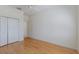Bedroom featuring hardwood floors, closet and neutral wall color at 9719 Discovery Ter, Bradenton, FL 34212