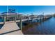Community boat dock showcasing a variety of boats, perfect for waterfront living and enjoying recreational boating at 9719 Discovery Ter, Bradenton, FL 34212