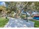 Scenic park pathway featuring benches, lush landscaping, and convenient kayak storage for outdoor enthusiasts and relaxation at 9719 Discovery Ter, Bradenton, FL 34212