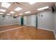 Spacious community fitness room with mirrors, laminate floors, and ample space for various exercise activities at 9719 Discovery Ter, Bradenton, FL 34212