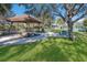 Scenic gazebo overlooking the water and surrounded by lush greenery and picnic tables at 9719 Discovery Ter, Bradenton, FL 34212