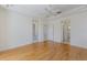 Spacious main bedroom featuring natural light, wood floors and crown molding at 9719 Discovery Ter, Bradenton, FL 34212