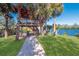 Elevated wooden overlook deck surrounded by palm trees with a beautiful view of the adjacent lake at 9719 Discovery Ter, Bradenton, FL 34212