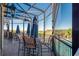Screened patio with outdoor seating and water views, perfect for relaxing or enjoying the community pool at 9719 Discovery Ter, Bradenton, FL 34212