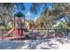 Community playground with slides, climbing equipment, and safety fencing for children to enjoy outdoor activities at 9719 Discovery Ter, Bradenton, FL 34212