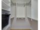 Organized walk-in closet with shelving, hanging rods, and a laundry basket at 9719 Discovery Ter, Bradenton, FL 34212