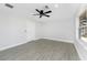 A bright bedroom with tile floors and a door leading to the outside at 10055 Franklin Dr, Englewood, FL 34224