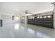Spacious three car garage with sealed floors ready for any hobby or car collection at 10055 Franklin Dr, Englewood, FL 34224