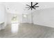 Large open living space with tile floors, vaulted ceiling and arched windows at 10055 Franklin Dr, Englewood, FL 34224