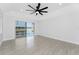 Living room featuring tile floors, recessed lighting, and a sliding glass door overlooking the outdoor pool area at 10055 Franklin Dr, Englewood, FL 34224