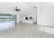 Open-concept living room showcasing tile floors, modern lighting, and a view of the pool at 10055 Franklin Dr, Englewood, FL 34224