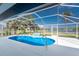Enjoy a relaxing swim in this beautiful pool with a scenic view of the lake at 10055 Franklin Dr, Englewood, FL 34224
