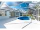 Stylish screen-enclosed pool area, seamlessly connected to the home's interior at 10055 Franklin Dr, Englewood, FL 34224