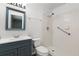 Updated bathroom featuring blue vanity with white countertop and walk-in shower at 1035 Axlewood Cir, Brandon, FL 33511