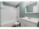 Bathroom featuring white vanity and shower and bath tub combo with tile surround at 1035 Axlewood Cir, Brandon, FL 33511