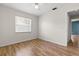 Bedroom featuring wood floors and a large window for ample natural light at 1035 Axlewood Cir, Brandon, FL 33511