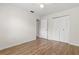 Bedroom featuring wood floors, closet, and ceiling fan for comfort at 1035 Axlewood Cir, Brandon, FL 33511