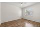 Bedroom featuring wood floors and large window for ample natural light at 1035 Axlewood Cir, Brandon, FL 33511