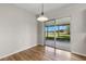 Bright dining area featuring wood floors and sliding glass doors to outdoor patio at 1035 Axlewood Cir, Brandon, FL 33511