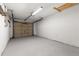Spacious garage with painted floor and garage door at 1035 Axlewood Cir, Brandon, FL 33511