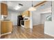 Functional kitchen with wood cabinets, black appliances, and wood-look flooring at 1035 Axlewood Cir, Brandon, FL 33511