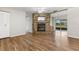 Bright living room featuring a stone fireplace, wood-look floors and sliding glass doors to the back at 1035 Axlewood Cir, Brandon, FL 33511