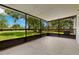 Inviting screened porch providing an outdoor living space with scenic backyard views at 1035 Axlewood Cir, Brandon, FL 33511