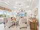 Bright living room with neutral tones, recessed lighting and access to the lanai at 1251 Tuscany Blvd, Venice, FL 34292
