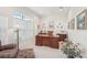 Elegant office with traditional wood desk, ample natural light, and neutral decor at 1251 Tuscany Blvd, Venice, FL 34292