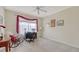 Well-lit bedroom with neutral carpet and desk area at 12520 Natureview Cir, Bradenton, FL 34212