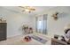 Cozy bedroom with a ceiling fan, natural light, and a relaxed atmosphere at 12520 Natureview Cir, Bradenton, FL 34212