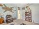 Inviting bedroom with eclectic decor, a cozy chair, and ample storage at 12520 Natureview Cir, Bradenton, FL 34212