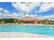 A stunning community pool with comfortable lounging areas and serene landscaping at 12520 Natureview Cir, Bradenton, FL 34212