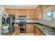 Functional kitchen with ample cabinet space, granite countertops, and modern appliances at 12520 Natureview Cir, Bradenton, FL 34212