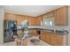 The island kitchen features granite countertops and barstool seating at 12520 Natureview Cir, Bradenton, FL 34212