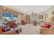 Open living room with plush seating, patterned drapes, and views of the screened lanai at 12520 Natureview Cir, Bradenton, FL 34212