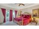 Spacious primary bedroom with a decorative ceiling, furnishings, and balcony access at 12520 Natureview Cir, Bradenton, FL 34212