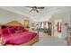 Spacious main bedroom with tray ceiling, complemented by a comfortable seating area at 12520 Natureview Cir, Bradenton, FL 34212