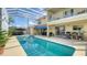 Enjoy this refreshing screened-in pool, a lovely blue awning, a grill, and lots of patio space to stretch out and relax at 12520 Natureview Cir, Bradenton, FL 34212