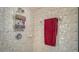 Close up of remodeled shower with decorative shelving for storage at 12520 Natureview Cir, Bradenton, FL 34212