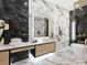 Bathroom with marble flooring, modern vanity, and a freestanding soaking tub at 1323 Loma Linda Ct, Sarasota, FL 34239